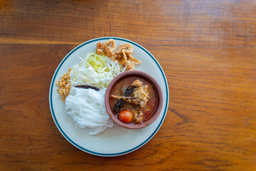 Khao Soi Nam Ngiao or Nam Ngiao is a noodles soup or curry of the cuisine Northern Style Curried Noodle Soup with braised pork ribs is the favorite delicious food of Northern Thai cuisine.