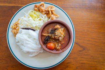 Khao Soi Nam Ngiao or Nam Ngiao is a noodles soup or curry of the cuisine Northern Style Curried Noodle Soup with braised pork ribs is the favorite delicious food of Northern Thai cuisine.