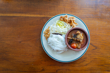 Khao Soi Nam Ngiao or Nam Ngiao is a noodles soup or curry of the cuisine Northern Style Curried Noodle Soup with braised pork ribs is the favorite delicious food of Northern Thai cuisine.