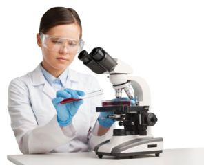 Young woman medical researcher looking through a modern microscope in a laboratory