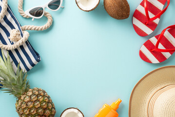 Transport yourself to a summer paradise with this alluring flat lay featuring sunhat, flip-flops, sunglasses, fruit, bag against a soothing pastel blue backdrop with blank space