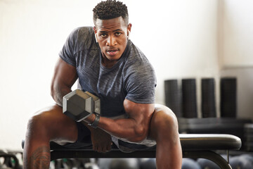Black man, bodybuilder and dumbbell in gym portrait for fitness, focus or training for growth, goal or competition. African guy, weightlifting and strong arms for training, wellness and muscle health