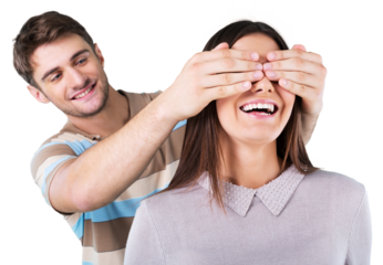 Young boyfriend covering the eyes of his girlfriend for a surprise