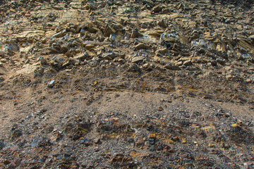 Old layers of soil in mountains. Abstract archeological background