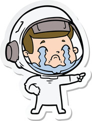 sticker of a cartoon crying astronaut