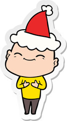happy hand drawn sticker cartoon of a bald man wearing santa hat