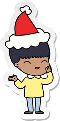 happy hand drawn sticker cartoon of a boy wearing santa hat