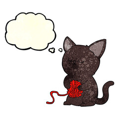 cartoon cute black cat playing with ball of yarn with thought bubble