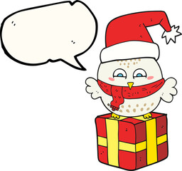 freehand drawn speech bubble cartoon cute christmas owl on wrapped present