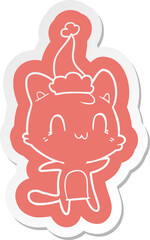 quirky cartoon  sticker of a happy cat wearing santa hat