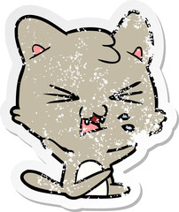 distressed sticker of a cartoon hissing cat