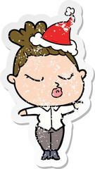 hand drawn distressed sticker cartoon of a calm woman wearing santa hat
