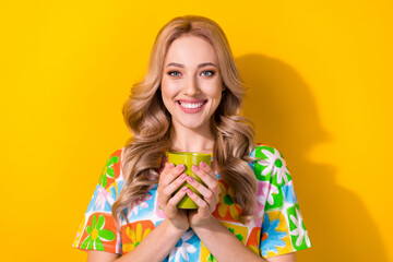 Photo of lovely lady hands hold green tea cup hot warming beverage wear trend shirt isolated yellow color background