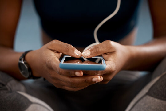 Woman, hands and phone at gym in social media, networking or communication after workout exercise. Hand of female person or athlete typing, texting or chatting on mobile smartphone app in health club - Powered by Adobe