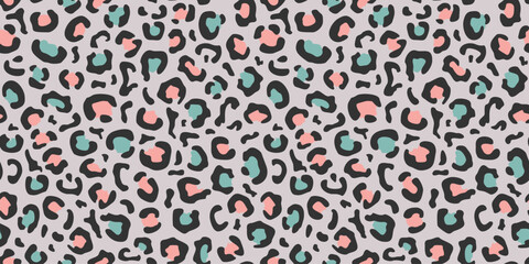 Seamless leopard pattern in black, green and pink colors on a gray background. Flat vector illustration