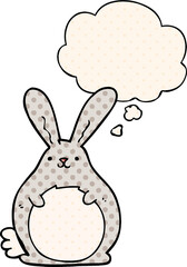 cartoon rabbit with thought bubble in comic book style