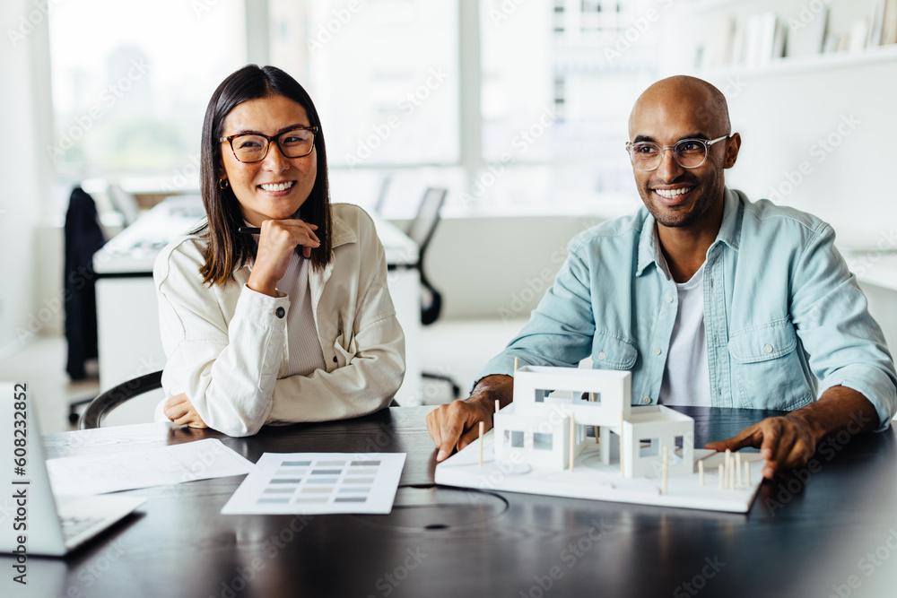 Aufkleber two architects working with a 3d house model in an office