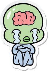 sticker of a cartoon big brain alien crying