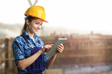 Portrait of proud construction worker managing logistics