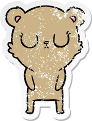 distressed sticker of a peaceful cartoon bear