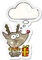 cartoon christmas reindeer with thought bubble as a distressed worn sticker