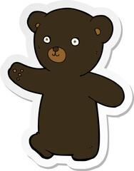 sticker of a cartoon black bear cub