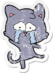 distressed sticker of a cartoon crying cat