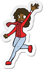 sticker of a cartoon woman waving dressed for winter