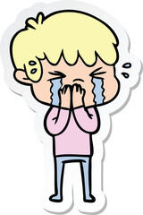 sticker of a cartoon boy crying