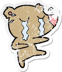 distressed sticker of a cartoon crying bear
