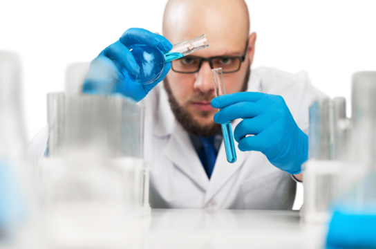 Male researcher carrying out scientific research in a lab with glassware