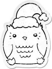 distressed sticker of a cute cartoon owl wearing christmas hat