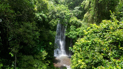Plakat Labuhan Kebo waterfall. Labuhan Kebo waterfall is a beautiful multi tier stream situated in a lush green valley. 