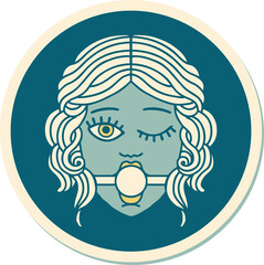 sticker of tattoo in traditional style of a winking female face wearing ball gag
