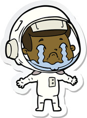 sticker of a cartoon crying astronaut