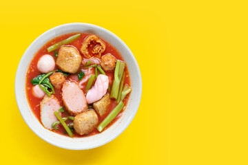 A bowl of pink flat noodles