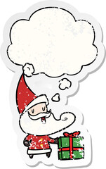 cartoon santa claus with thought bubble as a distressed worn sticker