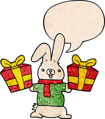 cartoon rabbit with christmas presents with speech bubble in retro texture style