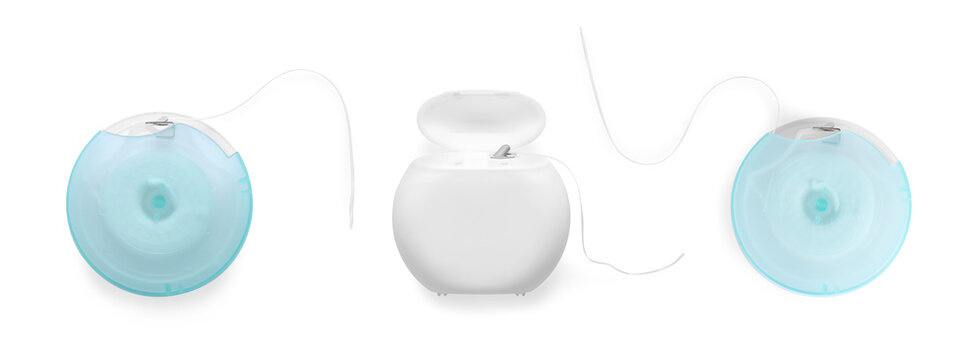 Set of different dental flosses on white background