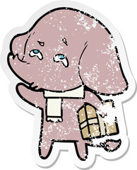 distressed sticker of a cartoon elephant with gift remembering