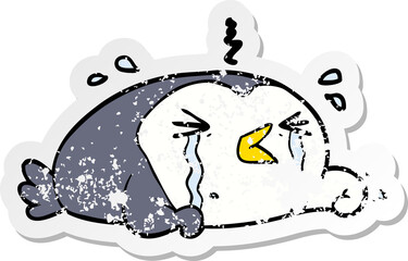 distressed sticker of a cartoon crying penguin