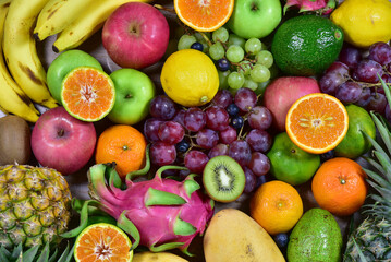 Naklejka na ściany i meble assorted fruits, top view healthy food concept Including high vitamin fruits, fresh fruits, thai fruits