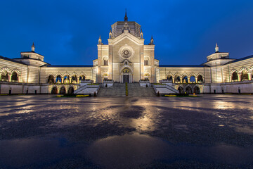 Monumental cemetery in Milan, Italy at night in the rain