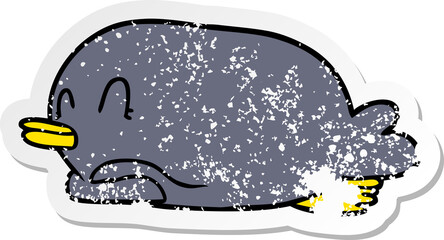 distressed sticker of a penguin lying on belly