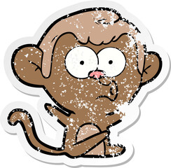 distressed sticker of a cartoon hooting monkey