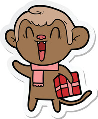 sticker of a cartoon laughing monkey