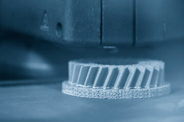 The additive manufacturing by 3D printer machine.
