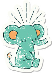worn old sticker of a tattoo style cute elephant