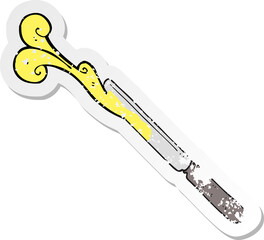 retro distressed sticker of a cartoon butter knife
