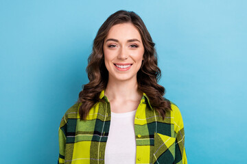 Portrait of friendly gorgeous pretty girl with wavy hairstyle wear plaid jacket toothy smiling at...